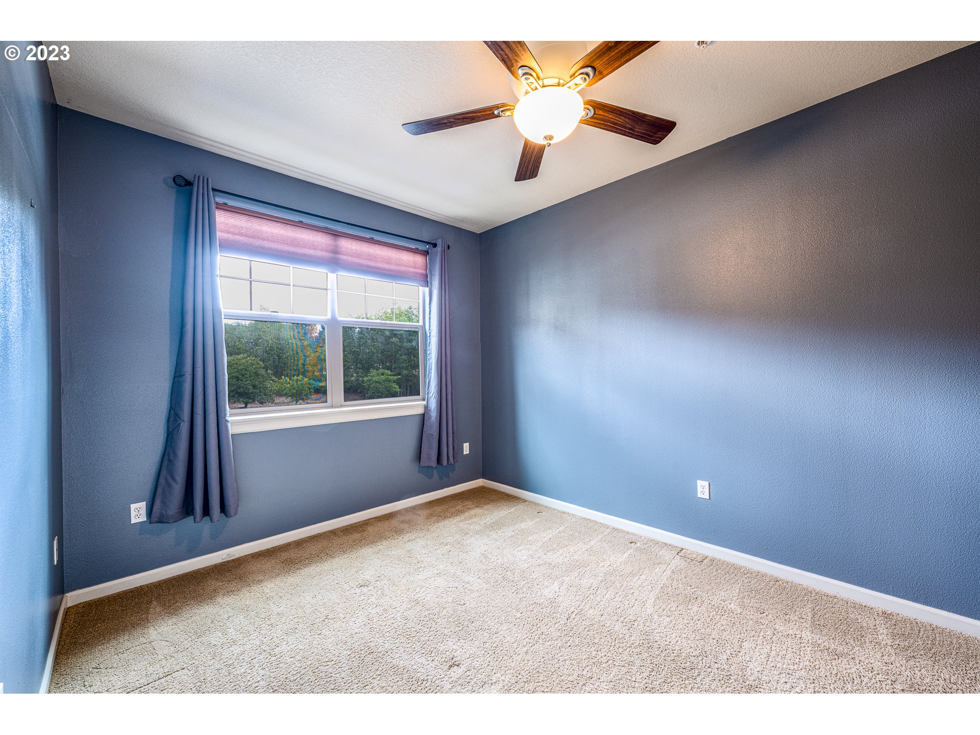 17335 Ruben Lane, Unit 19 Sandy, OR 97055 - Photo 10 of 27 a view of an empty room with a window