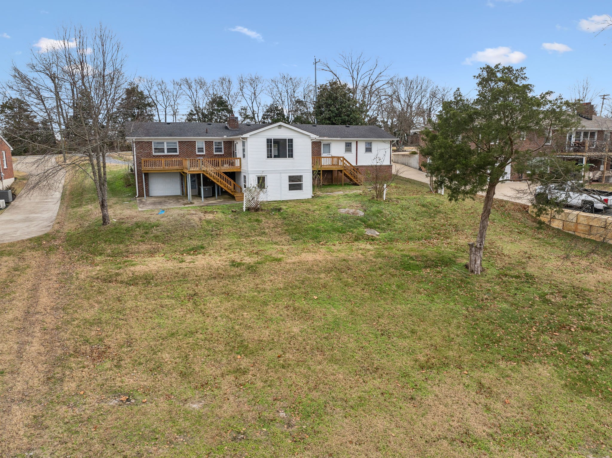 1108 Lock 4 Road Gallatin, TN 37066 - Photo 8 of 49 a view of a house with a yard and sitting area
