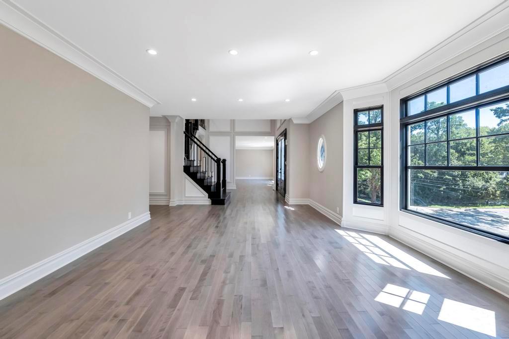 589 Old Bridge Road Northport, NY 11768 - Photo 12 of 40 a view of an empty room with wooden floor and a window