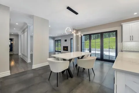 a view of a livingroom with furniture window and wooden floor