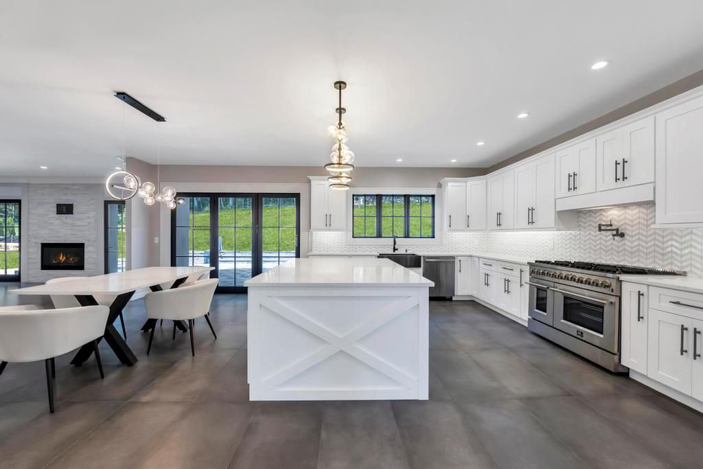 589 Old Bridge Road Northport, NY 11768 - Photo 22 of 40 a large white kitchen with lots of counter space a sink and appliances