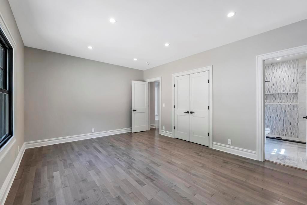 589 Old Bridge Road Northport, NY 11768 - Photo 25 of 40 a view of an empty room with wooden floor and closet