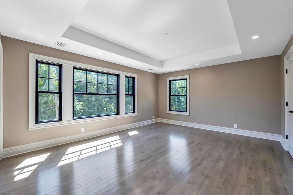 589 Old Bridge Road Northport, NY 11768 - Photo 28 of 40 a view of an empty room with wooden floor and a window
