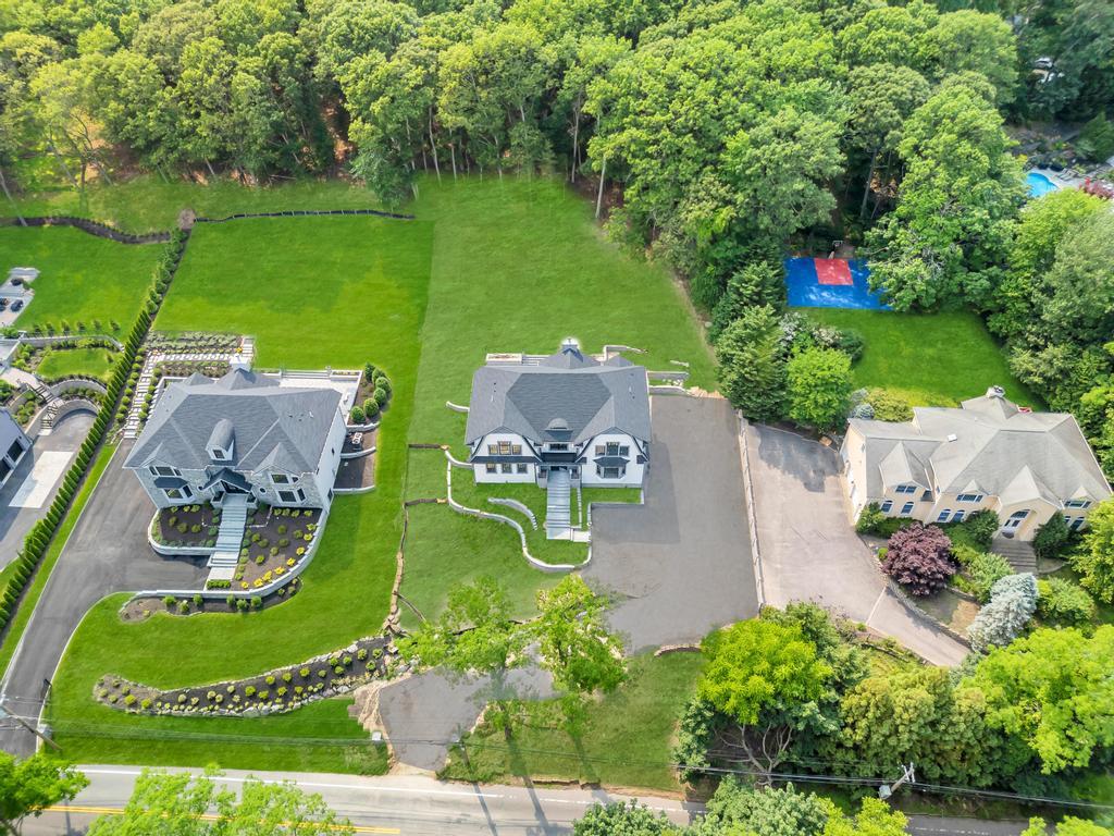589 Old Bridge Road Northport, NY 11768 - Photo 3 of 40 an aerial view of a house with garden space and outdoor seating