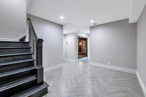 a view of an entryway with wooden floor