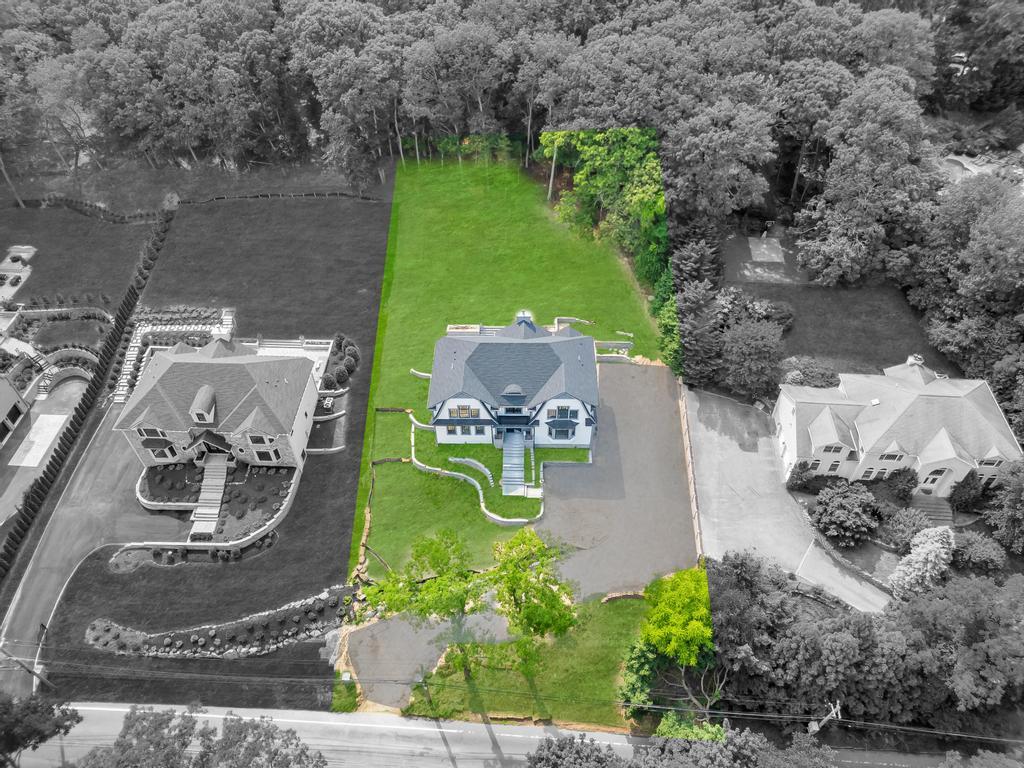 589 Old Bridge Road Northport, NY 11768 - Photo 4 of 40 an aerial view of a house with a yard and lake view