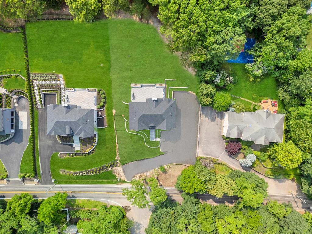 589 Old Bridge Road Northport, NY 11768 - Photo 6 of 40 an aerial view of a house with a garden and plants