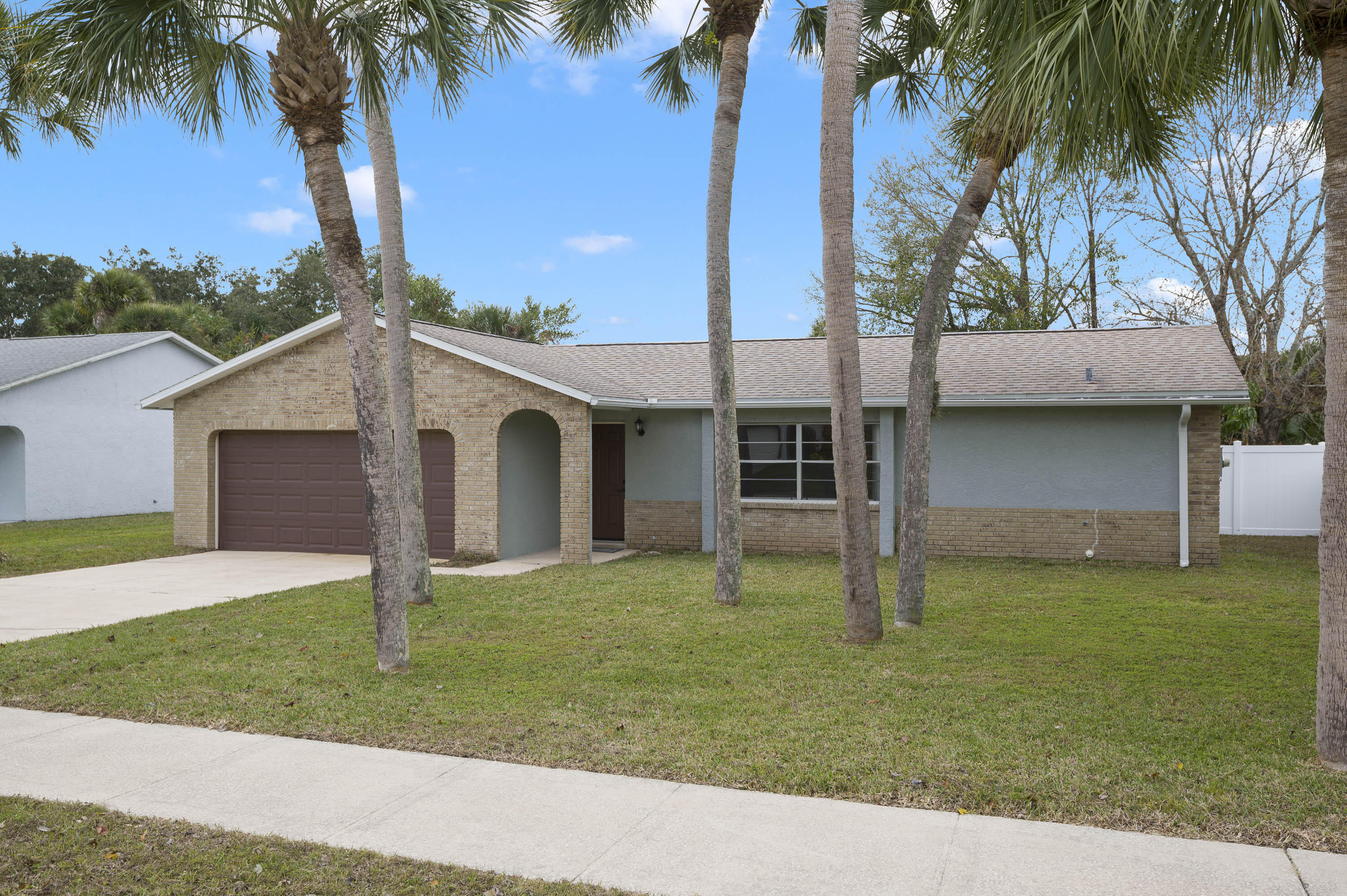 2331 Scotland Road Cocoa, FL 32926 - Photo 1 of 20 a view of a yard with a house and a palm tree