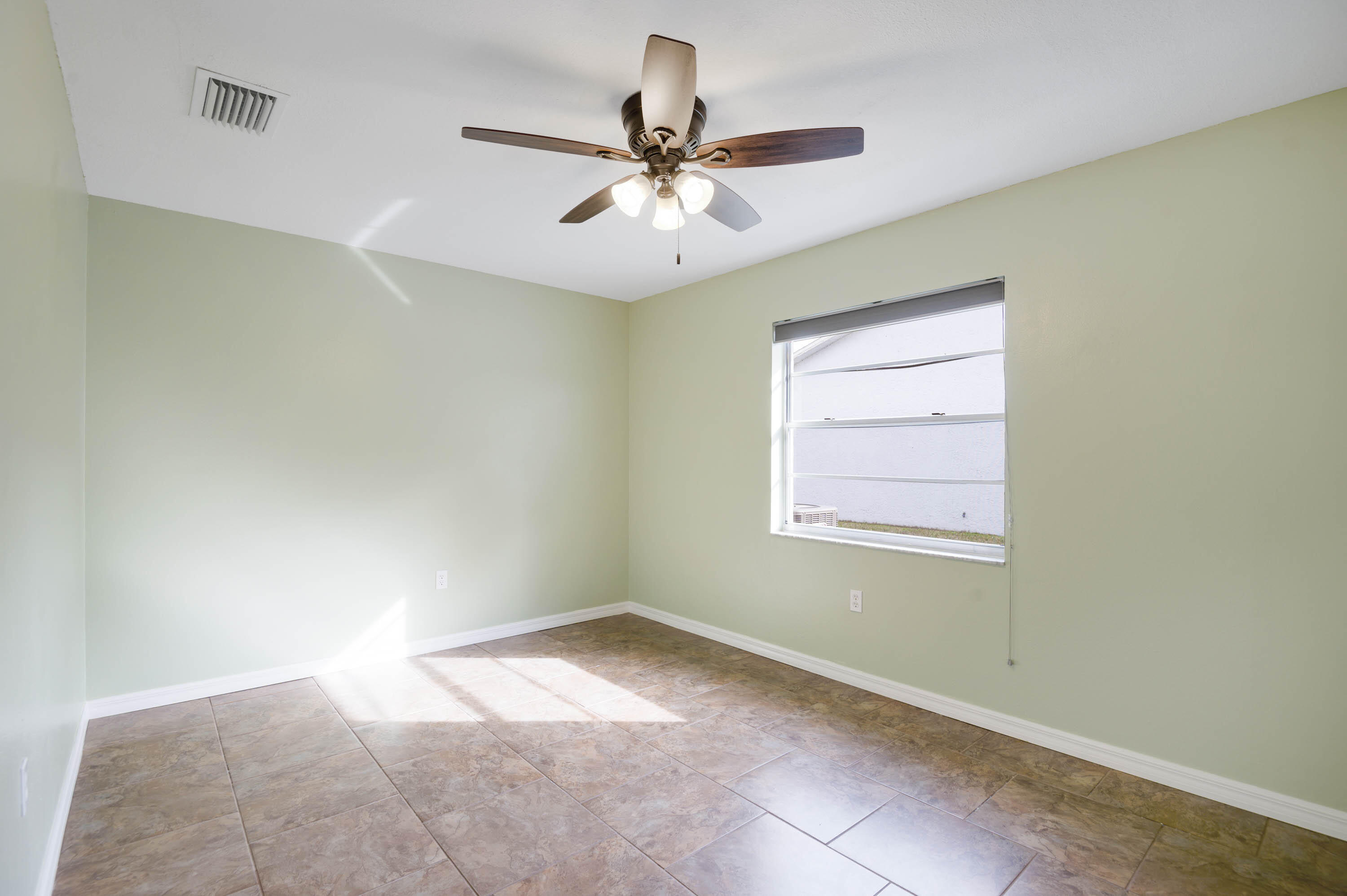 2331 Scotland Road Cocoa, FL 32926 - Photo 15 of 20 a view of room with window and ceiling fan