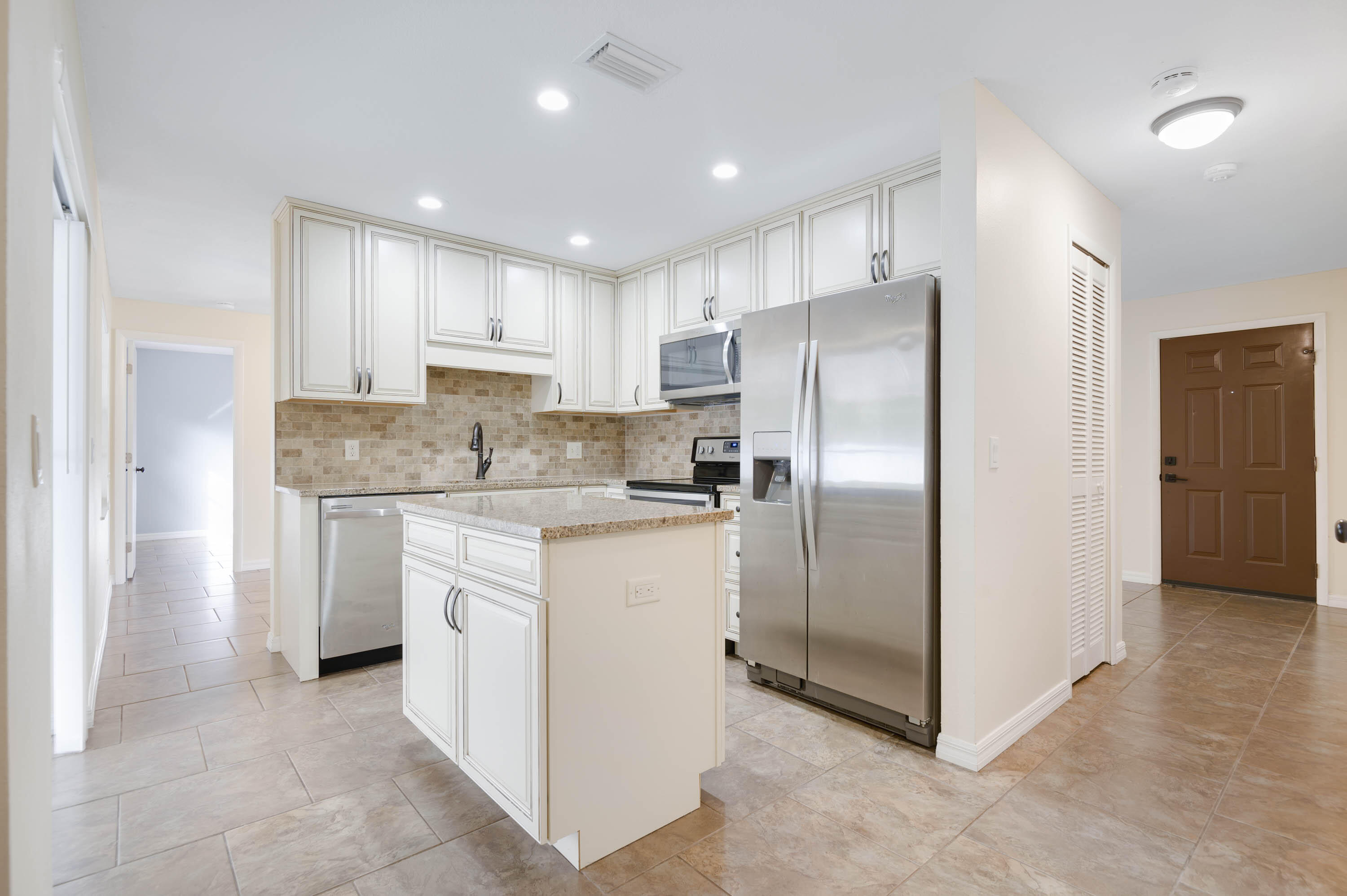 2331 Scotland Road Cocoa, FL 32926 - Photo 3 of 20 a kitchen with stainless steel appliances granite countertop a refrigerator and a stove