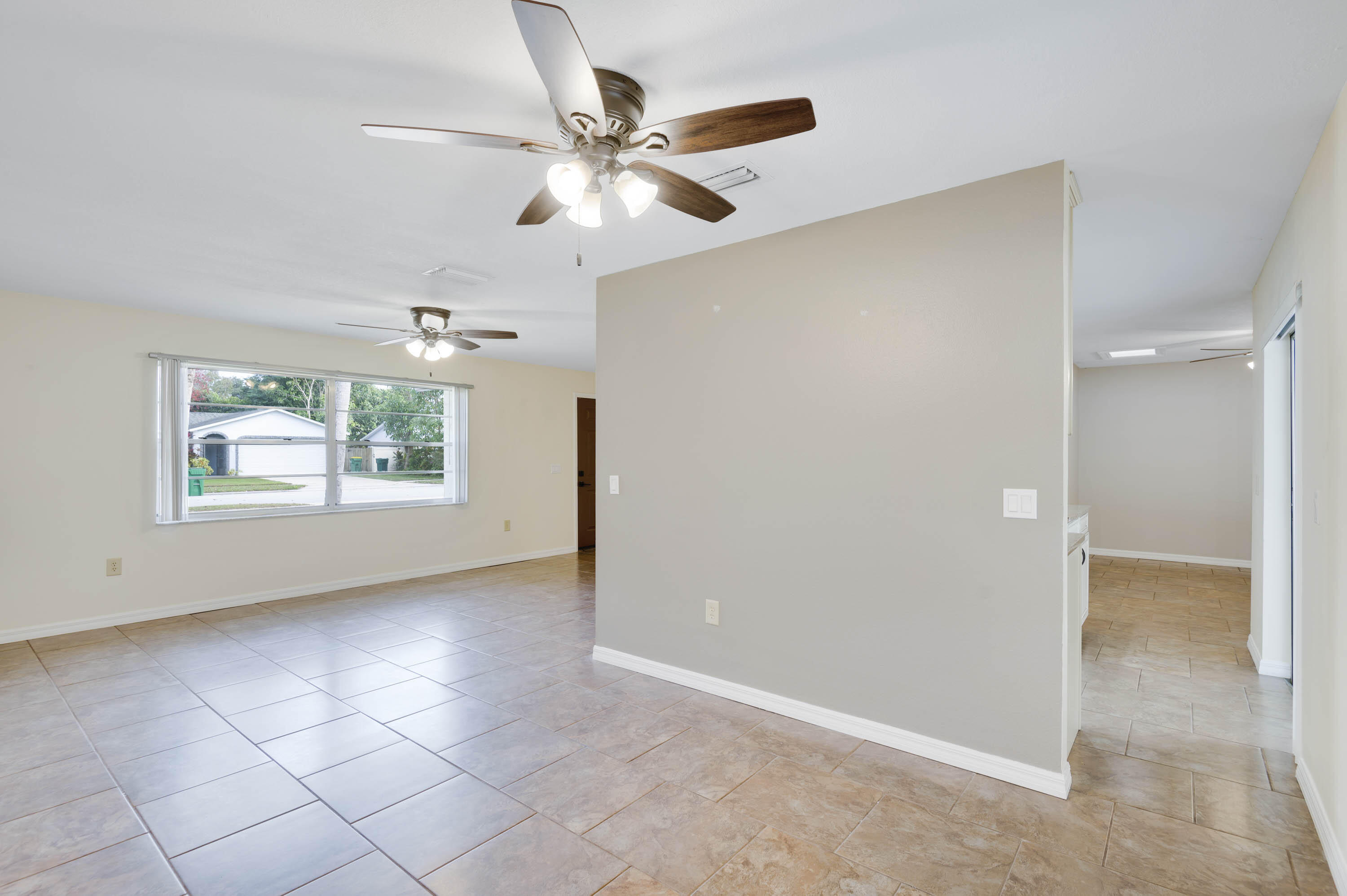 2331 Scotland Road Cocoa, FL 32926 - Photo 10 of 20 an empty room with windows and fan