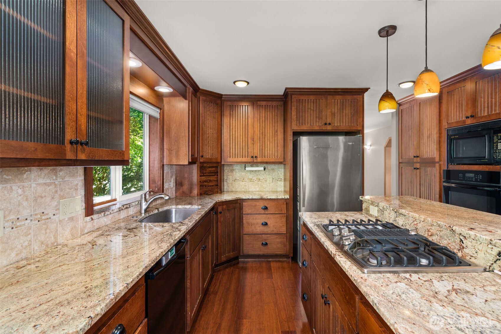 125 Mill Creek Road Raymond, WA 98577 - Photo 15 of 40 a kitchen with stainless steel appliances granite countertop a stove a sink and a refrigerator