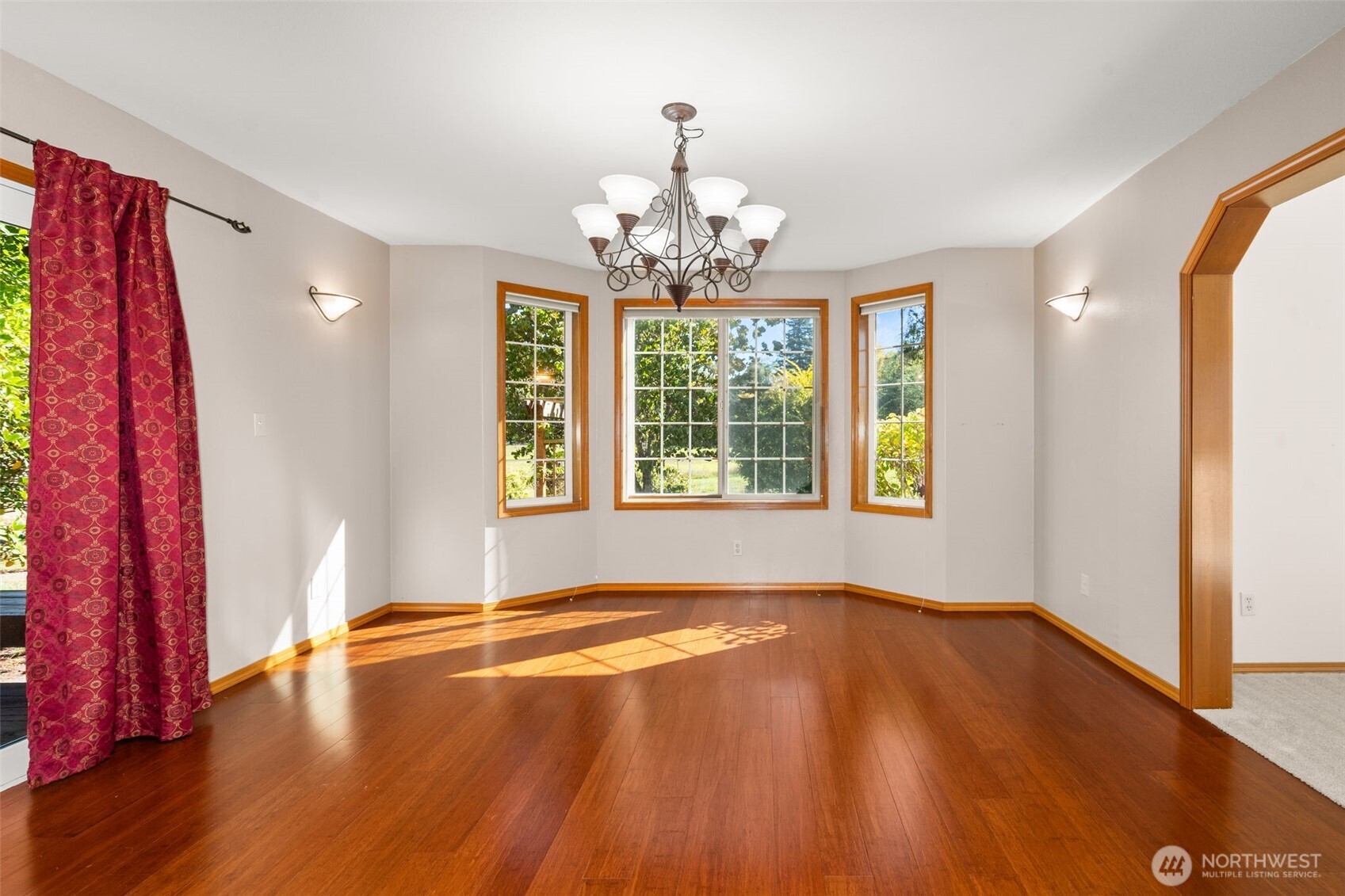 125 Mill Creek Road Raymond, WA 98577 - Photo 18 of 40 a view of a livingroom with wooden floor and a window