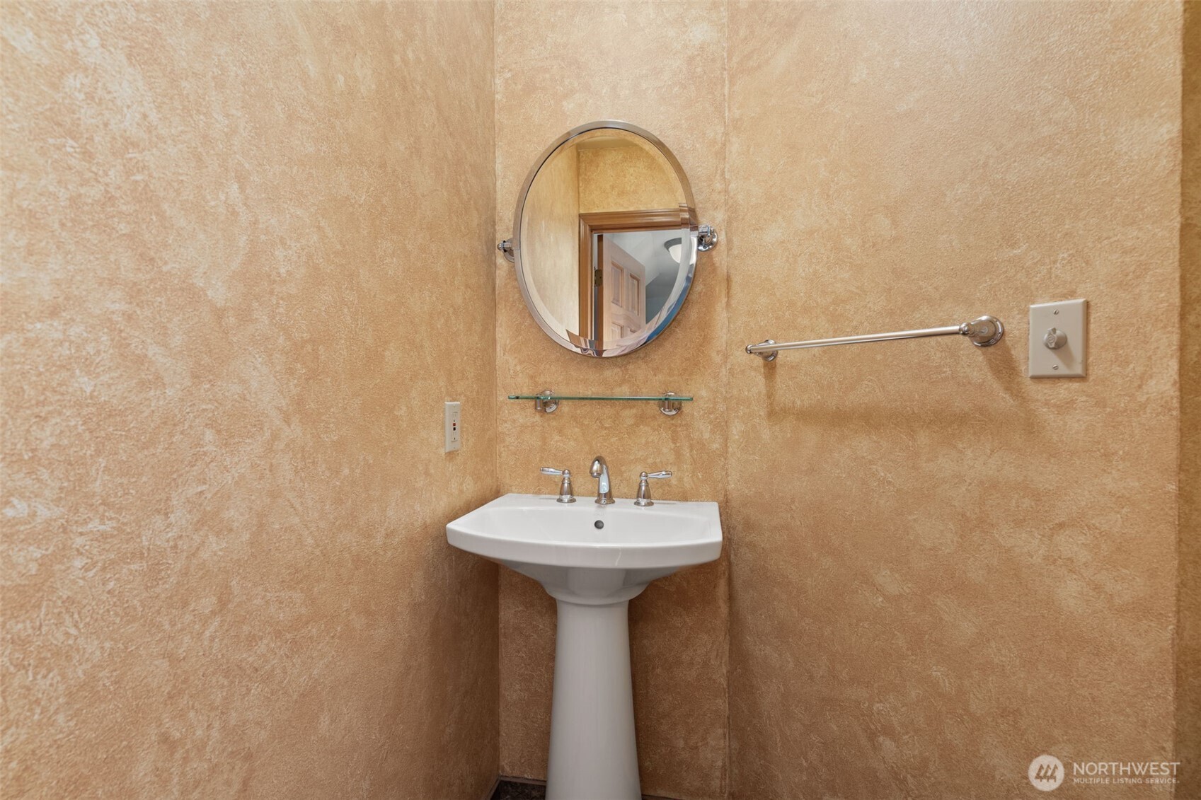 125 Mill Creek Road Raymond, WA 98577 - Photo 19 of 40 a bathroom with a sink and a mirror