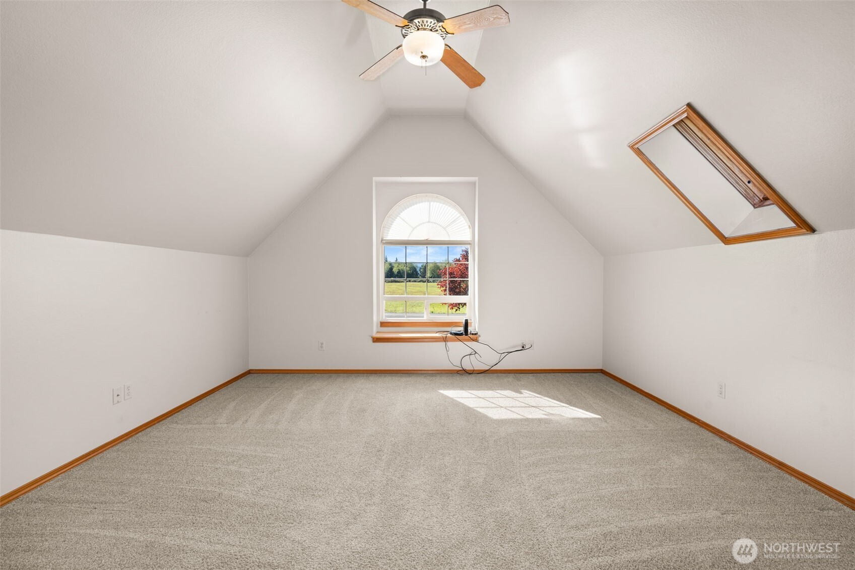 125 Mill Creek Road Raymond, WA 98577 - Photo 27 of 40 an empty room with windows and fan