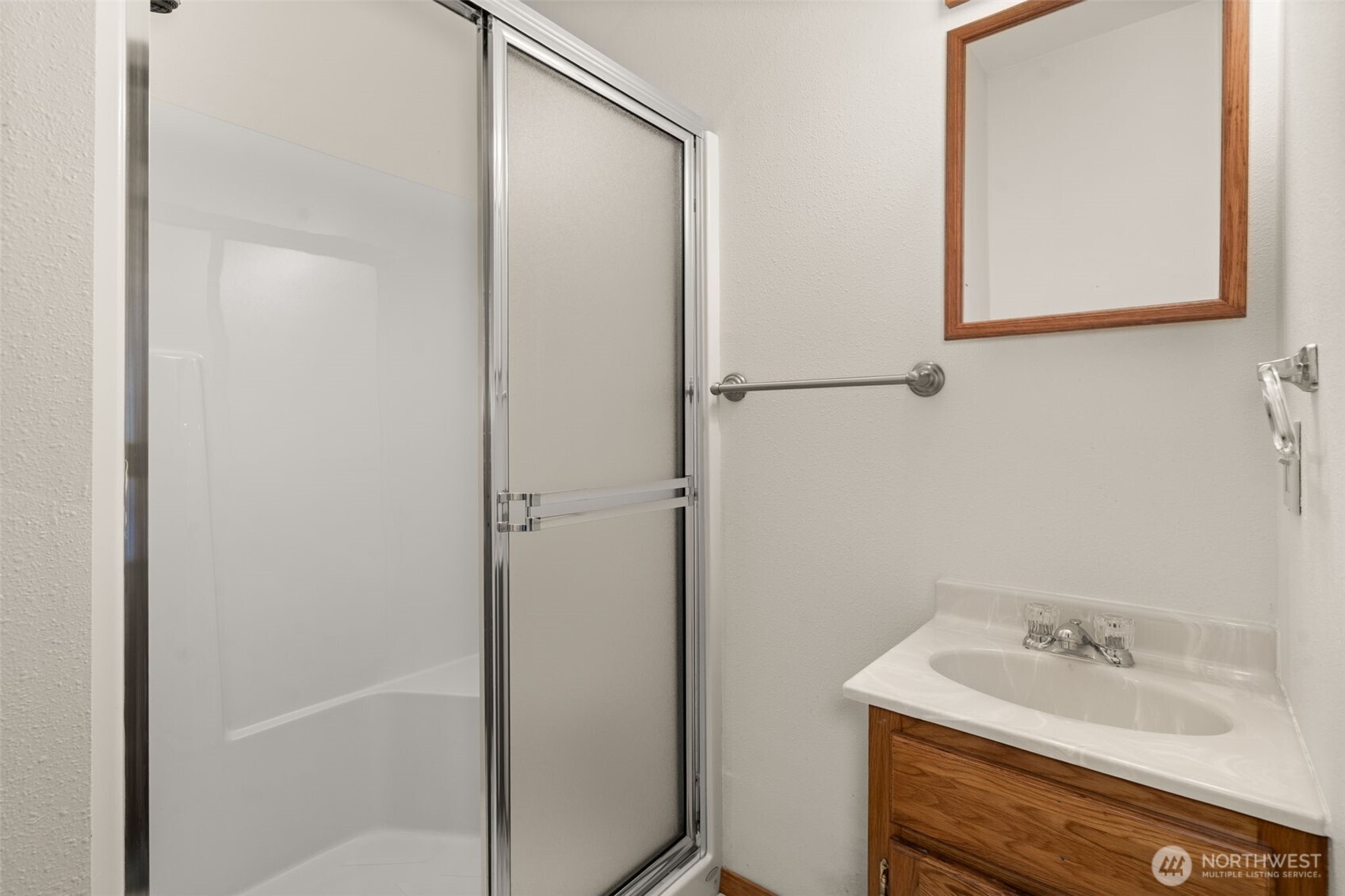 125 Mill Creek Road Raymond, WA 98577 - Photo 34 of 40 a bathroom with a sink and a mirror