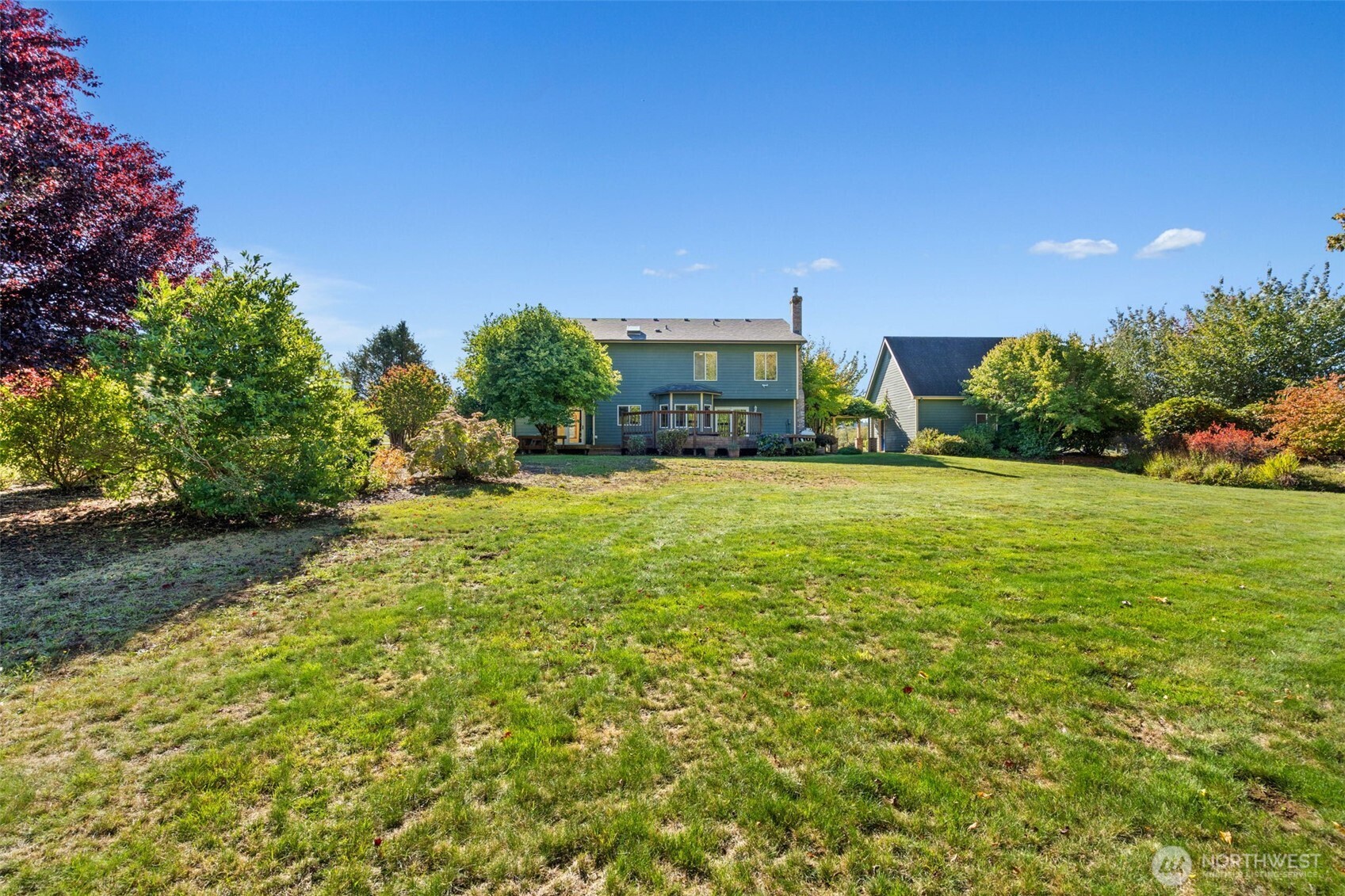 125 Mill Creek Road Raymond, WA 98577 - Photo 39 of 40 a view of a house with a yard and garage