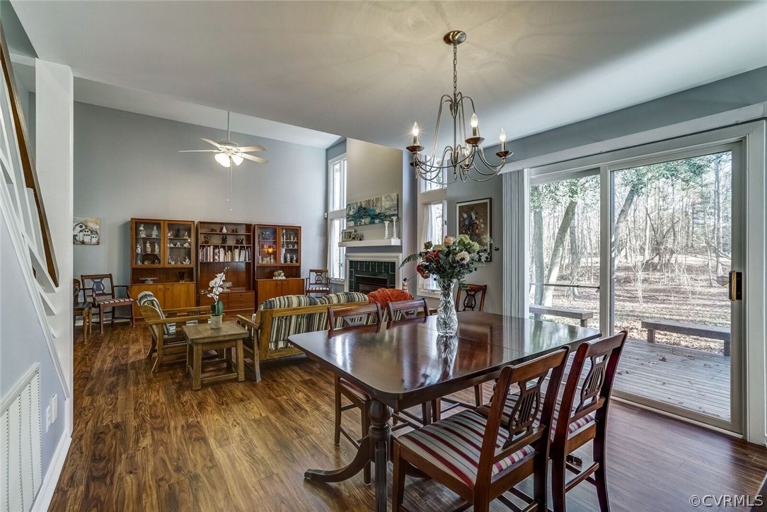 13801 Sandy Oak Road Chester, VA 23831 - Photo 8 of 22 a view of a dining room with furniture window and wooden floor