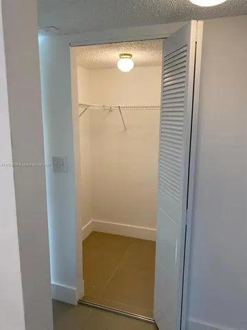 a room with a walk in closet and a window