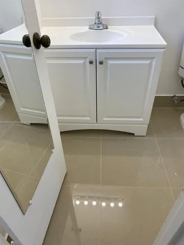a bathroom with a sink a toilet and a bathtub