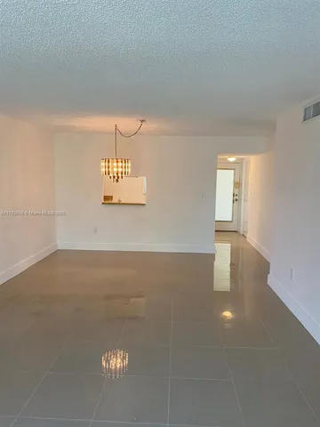 a view of a room that has a large window