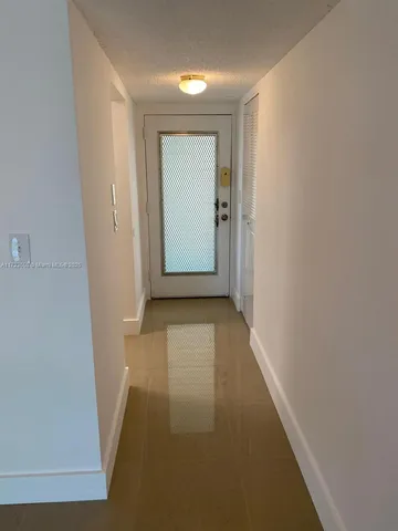 a close up of a wall with a clock