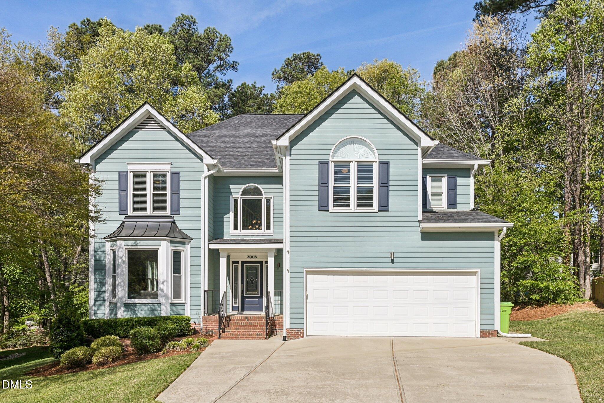 3008 Walton Heath Court Raleigh, NC 27612 - Photo 1 of 57 a front view of a house with a yard and garage