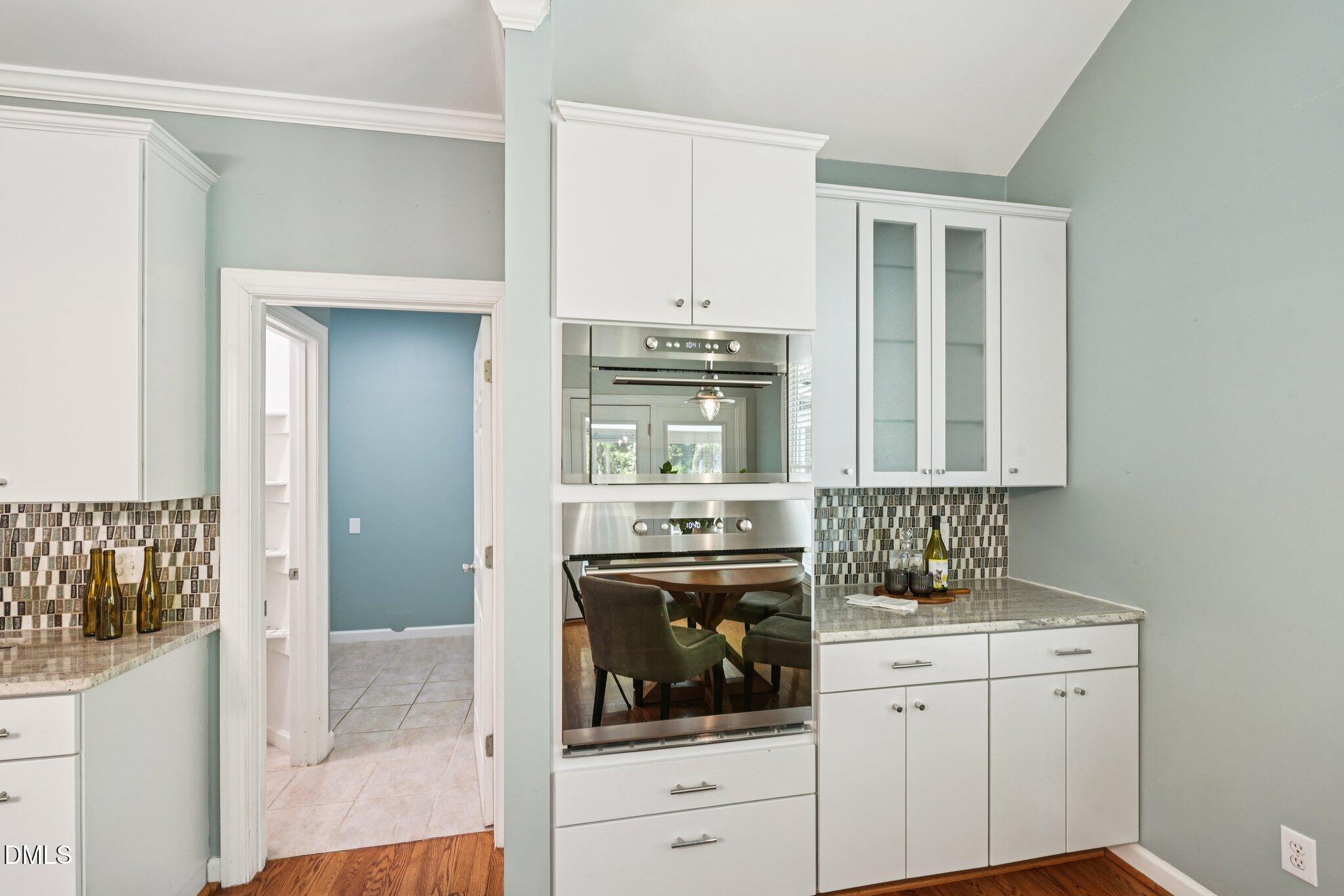 3008 Walton Heath Court Raleigh, NC 27612 - Photo 15 of 57 a kitchen with cabinets stainless steel appliances and a counter space