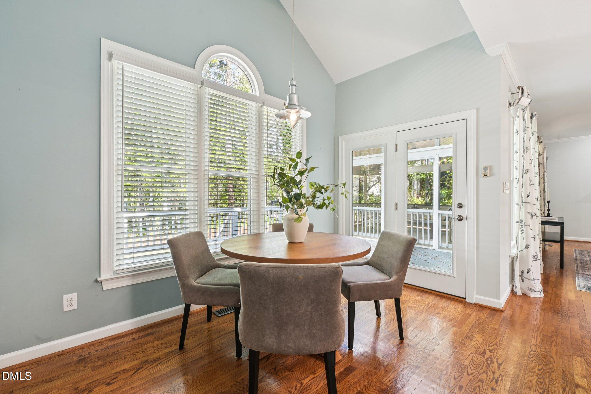 3008 Walton Heath Court Raleigh, NC 27612 - Photo 20 of 57 a dining room with furniture and wooden floor