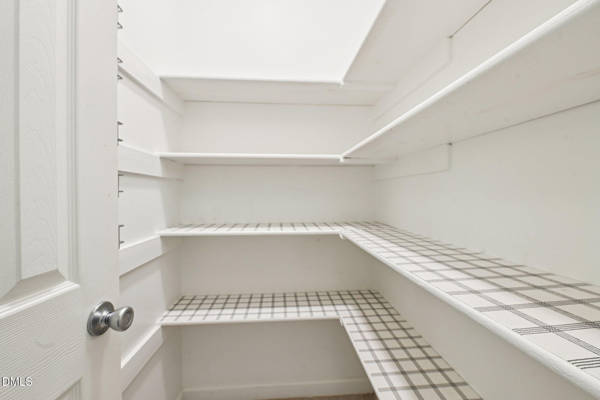 3008 Walton Heath Court Raleigh, NC 27612 - Photo 21 of 57 a view of utility room with racks on the wall