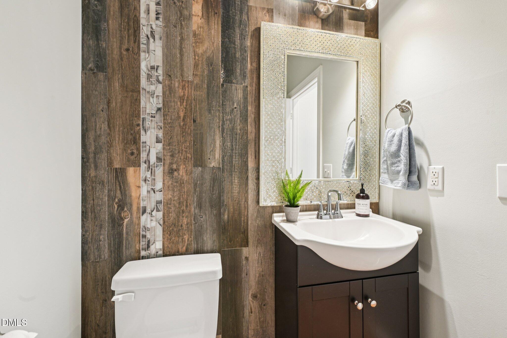 3008 Walton Heath Court Raleigh, NC 27612 - Photo 23 of 57 a bathroom with a sink a toilet and shower