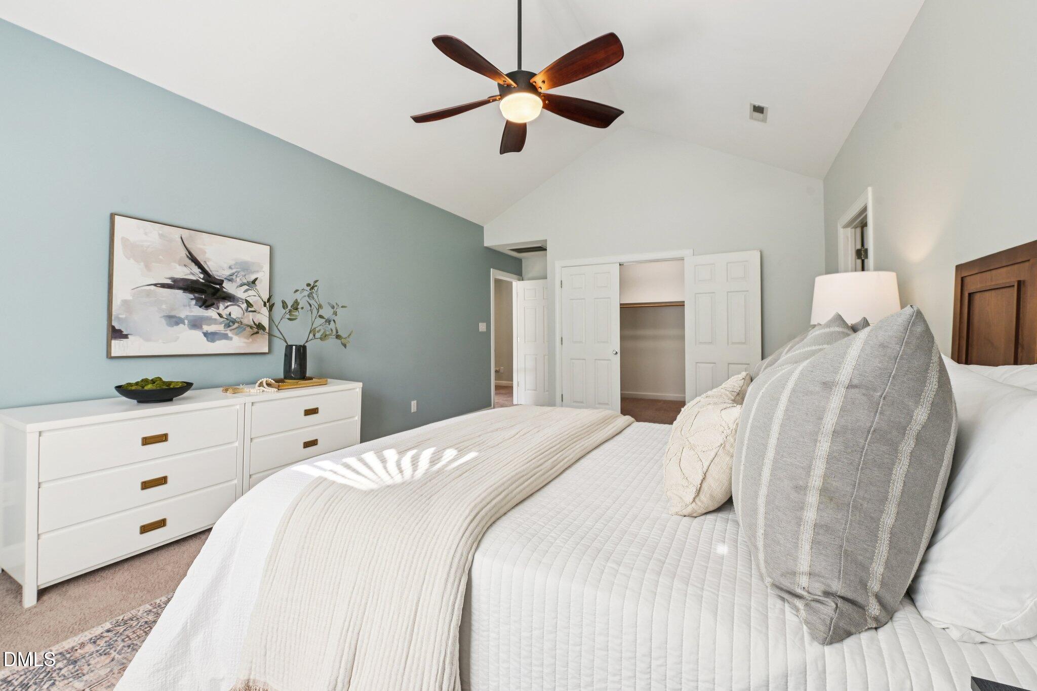 3008 Walton Heath Court Raleigh, NC 27612 - Photo 26 of 57 a bedroom with a bed and painting on the wall