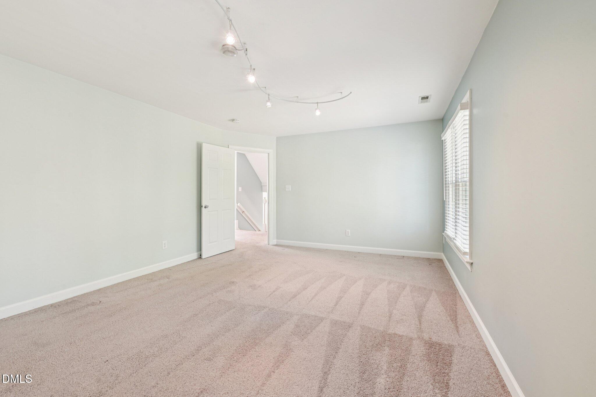 3008 Walton Heath Court Raleigh, NC 27612 - Photo 35 of 57 an empty room with a natural light