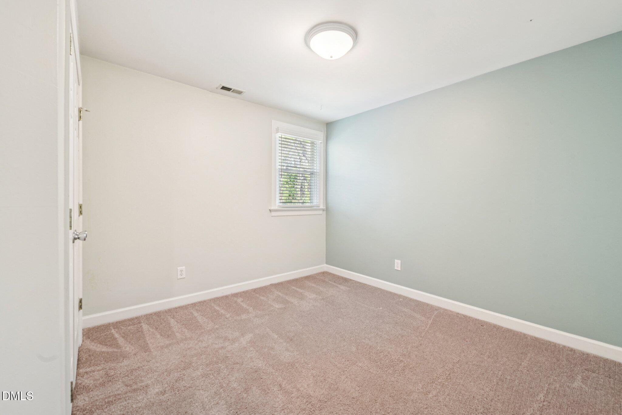 3008 Walton Heath Court Raleigh, NC 27612 - Photo 36 of 57 an empty room with windows