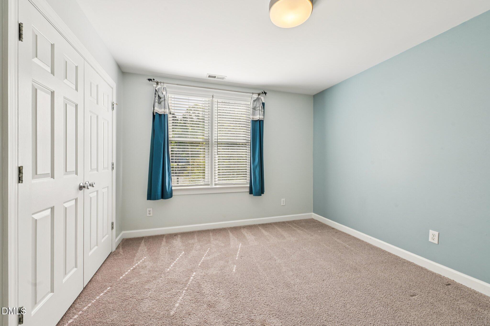 3008 Walton Heath Court Raleigh, NC 27612 - Photo 40 of 57 a view of an empty room with a window