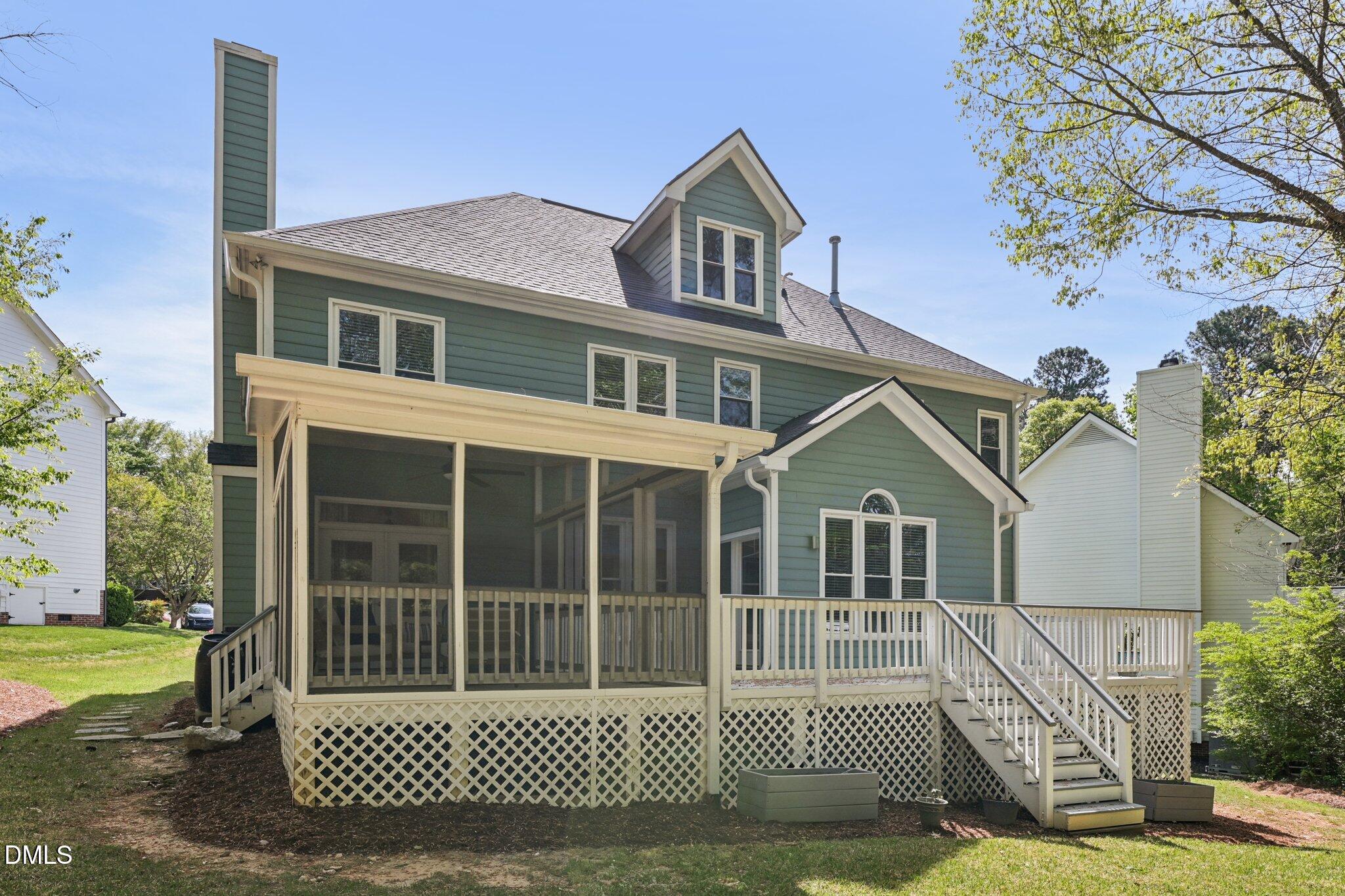 3008 Walton Heath Court Raleigh, NC 27612 - Photo 56 of 57 a view of a white house with a large windows