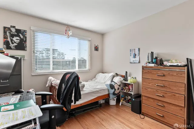 a bedroom with a bed and a table in it