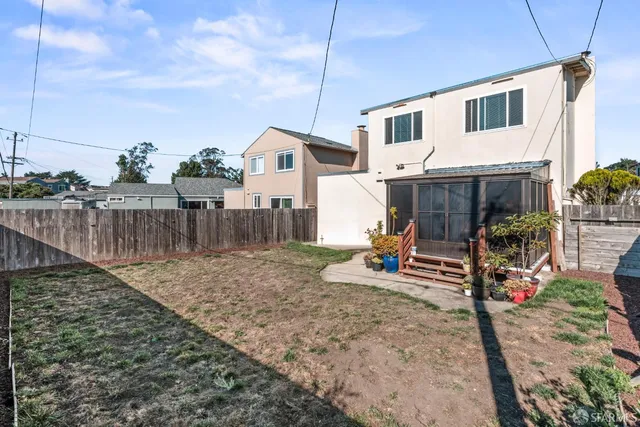 a front view of a house with garden and porch
