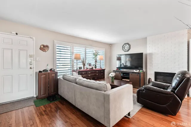 a living room with furniture and a flat screen tv