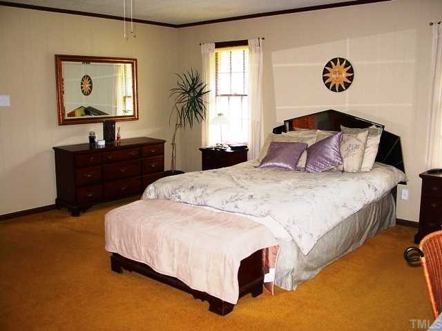 Large Master bedroom can be acessed off of foyer or main hallway; His and Hers dressing areas and separate bathrooms. Needs updating but has great potential.