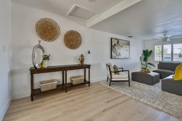 a living room with furniture and a window