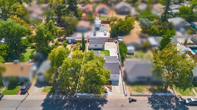 a kitchen with stainless steel appliances a sink a stove and a refrigerator