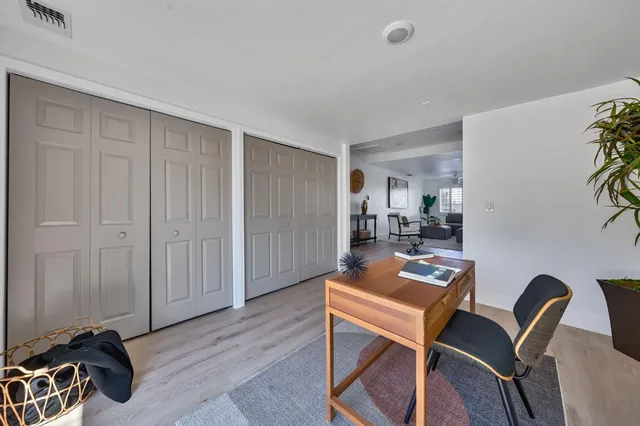a view of a house with backyard sitting area and garden