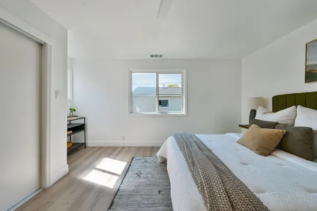 a view of a backyard with sitting area