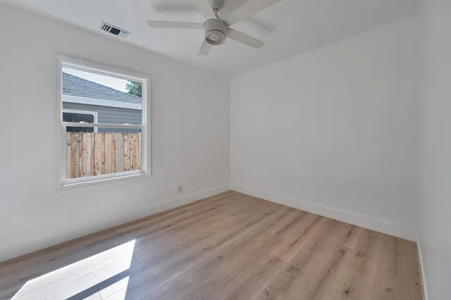 an aerial view of residential houses with outdoor space and swimming pool