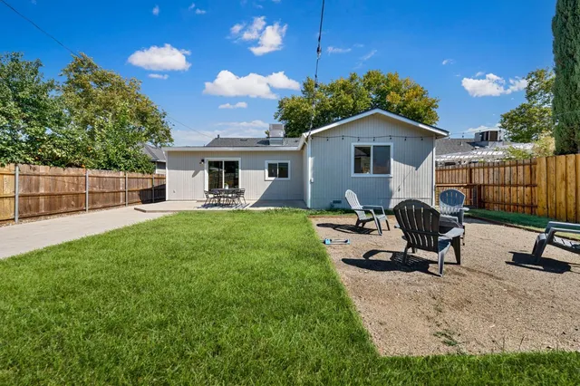 an aerial view of residential houses with city view