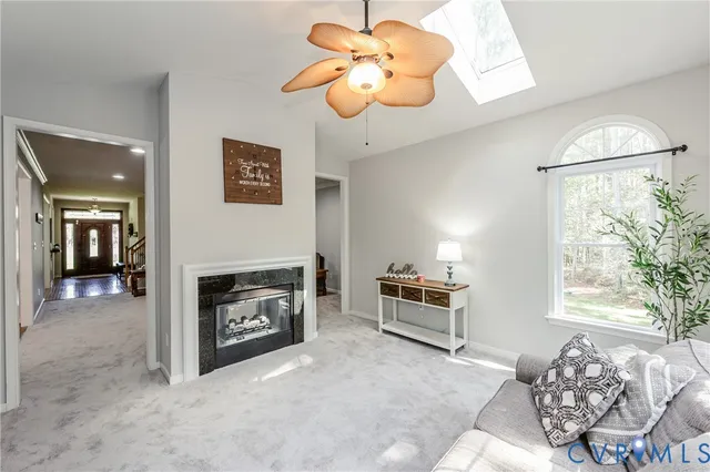 a view of a livingroom with furniture and a fireplace