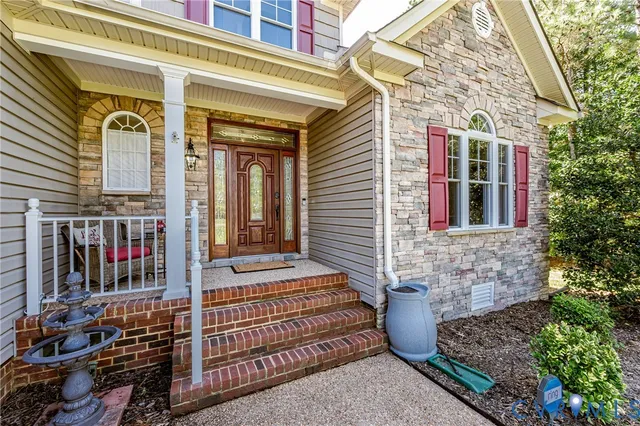 a front view of a house with stairs