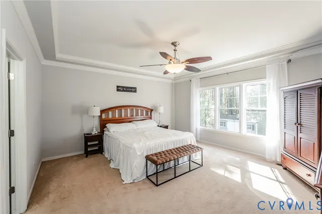 a spacious bedroom with a bed and a large window