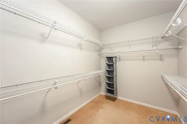 a view of an empty walk in closet